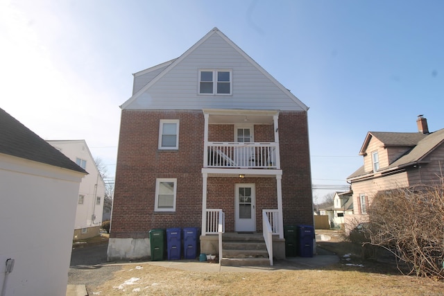 rear view of house with a balcony