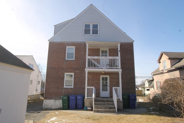 rear view of house with a balcony