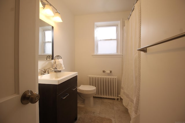 bathroom featuring vanity, radiator, tile patterned floors, and toilet