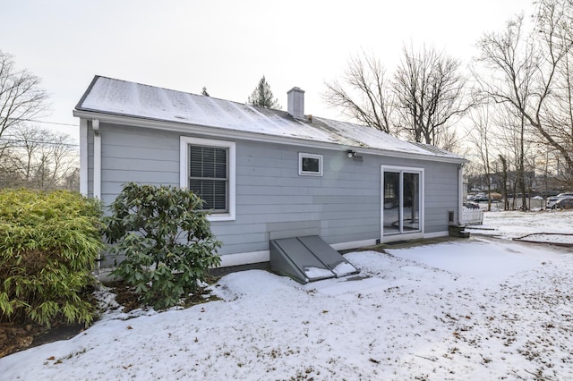 view of snow covered house