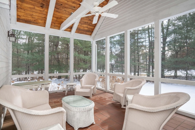 sunroom / solarium featuring wood ceiling, ceiling fan, and lofted ceiling with beams