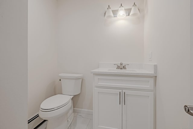 bathroom with vanity, a baseboard heating unit, and toilet