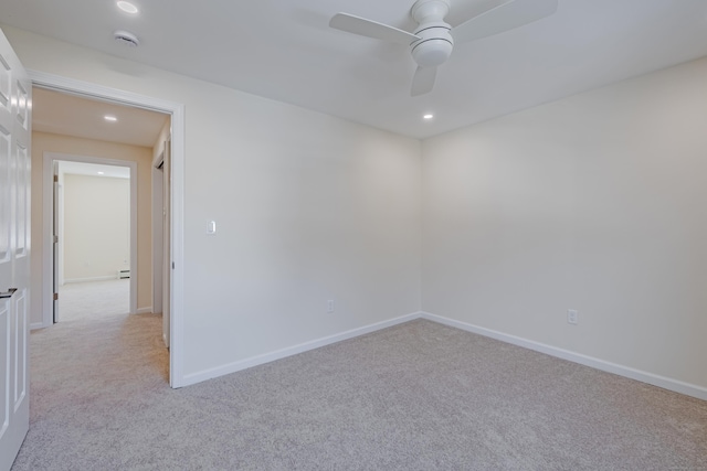 unfurnished room with light carpet and ceiling fan