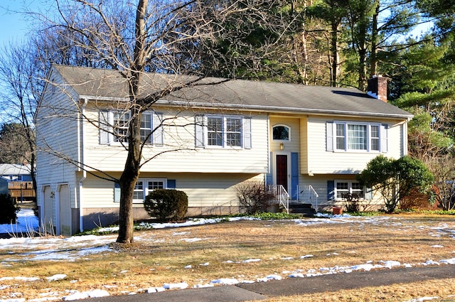 bi-level home featuring a garage