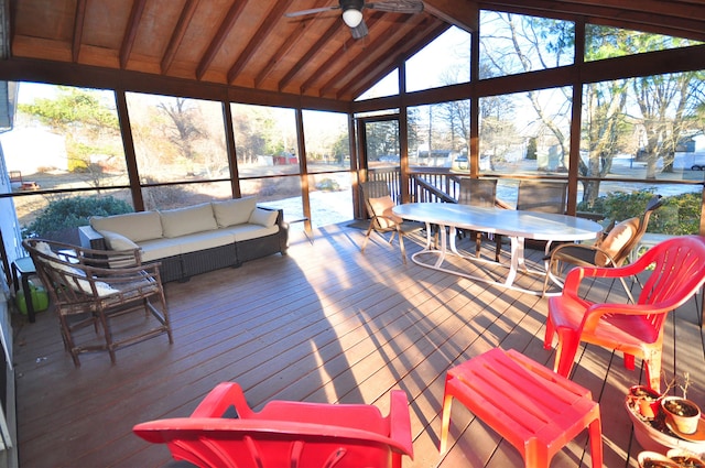 sunroom with vaulted ceiling with beams and ceiling fan