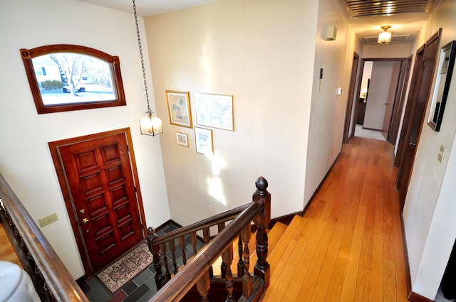 hallway with wood-type flooring