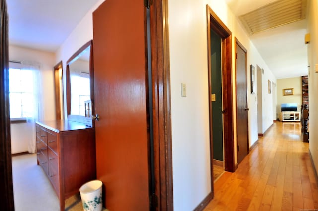 hallway with light wood-type flooring