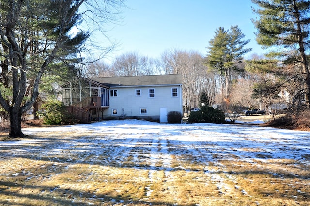 snow covered property featuring a deck