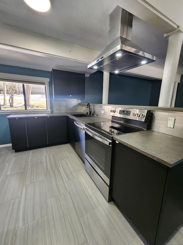 kitchen featuring sink, appliances with stainless steel finishes, backsplash, island range hood, and a textured ceiling