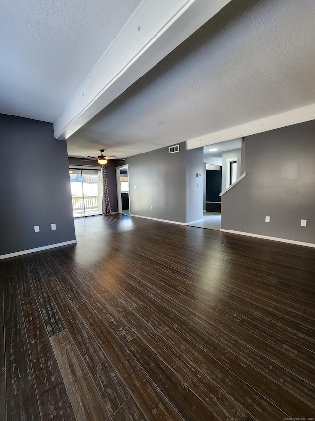 unfurnished living room with ceiling fan, wood-type flooring, and a textured ceiling