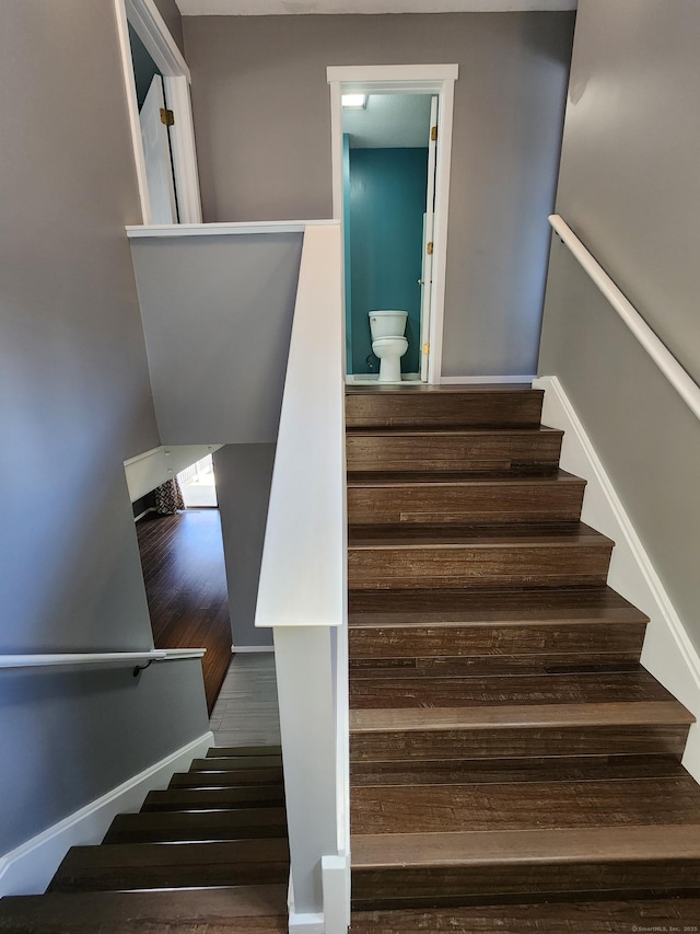 stairway featuring hardwood / wood-style floors