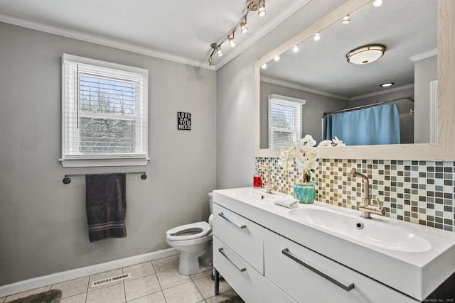 bathroom featuring ornamental molding, vanity, tile patterned floors, and decorative backsplash