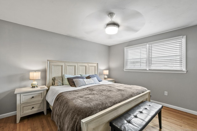 bedroom featuring hardwood / wood-style floors and ceiling fan