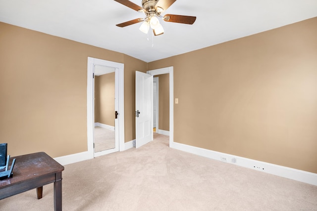 home office with light colored carpet and ceiling fan