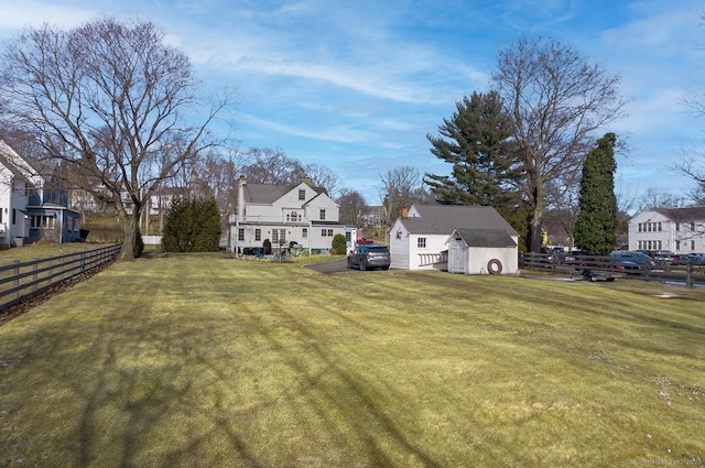 view of yard with a storage unit