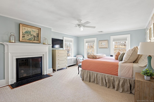 bedroom featuring multiple windows, crown molding, and light carpet