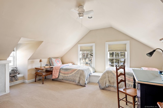 carpeted bedroom with lofted ceiling and ceiling fan