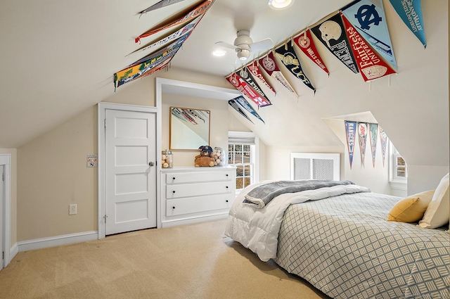 bedroom featuring vaulted ceiling and light carpet