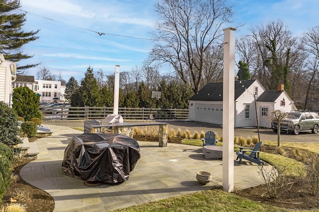 view of patio / terrace featuring a garage