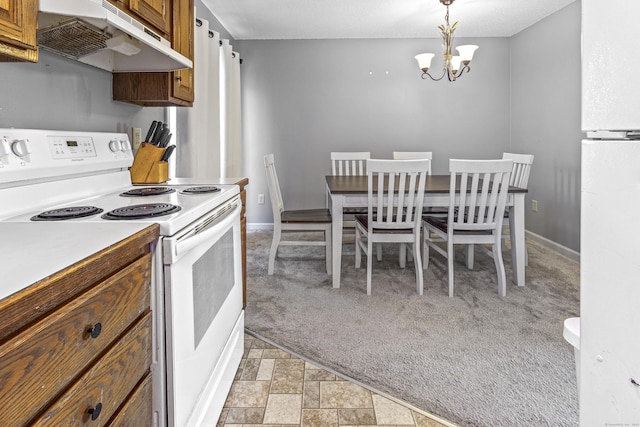 kitchen featuring pendant lighting, white appliances, an inviting chandelier, and light carpet