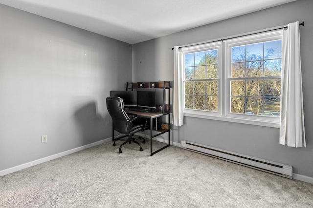 office with a baseboard radiator and carpet