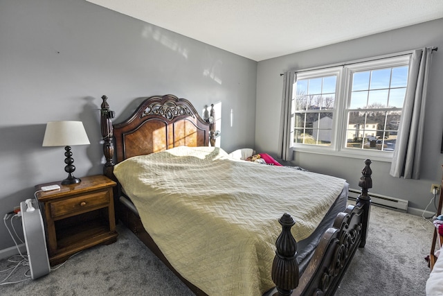 bedroom with carpet floors and baseboard heating