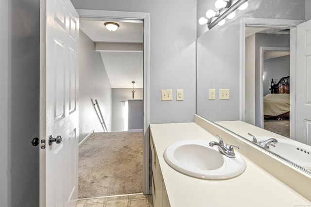 bathroom with tile patterned floors and vanity