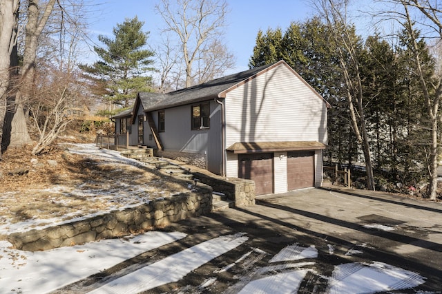 view of side of home with a garage