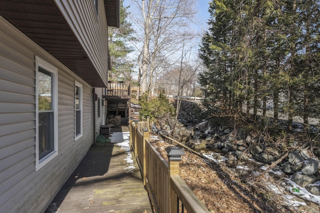 view of home's exterior featuring a wooden deck