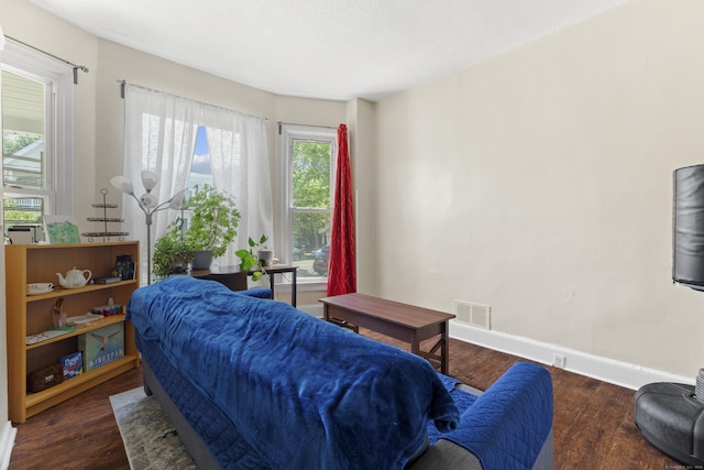 bedroom featuring dark hardwood / wood-style flooring