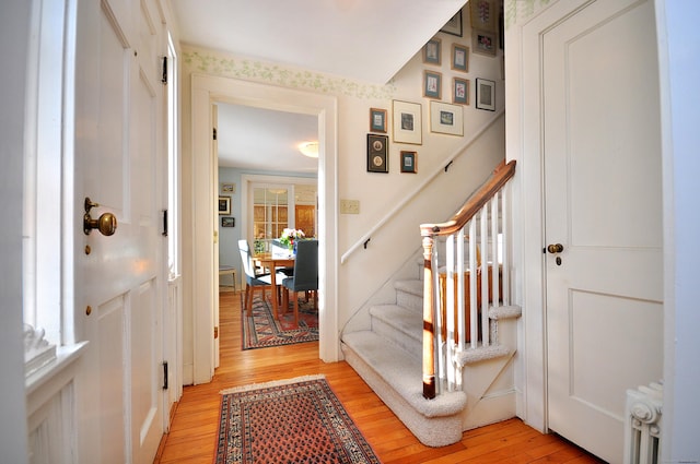 entryway featuring radiator and light wood-type flooring