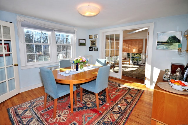 dining area featuring french doors and hardwood / wood-style floors