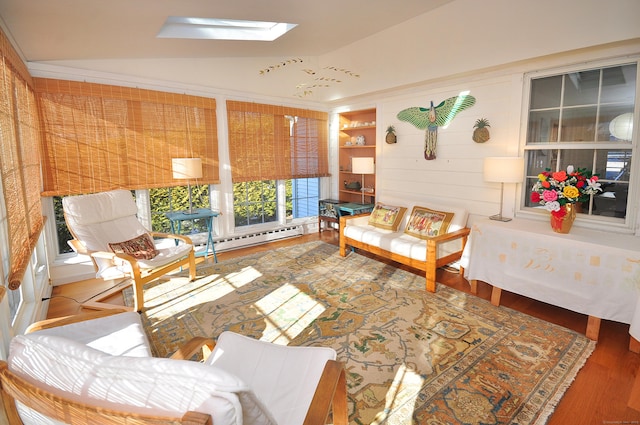 interior space featuring lofted ceiling with skylight