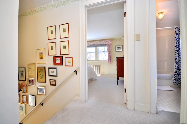 hall featuring light colored carpet