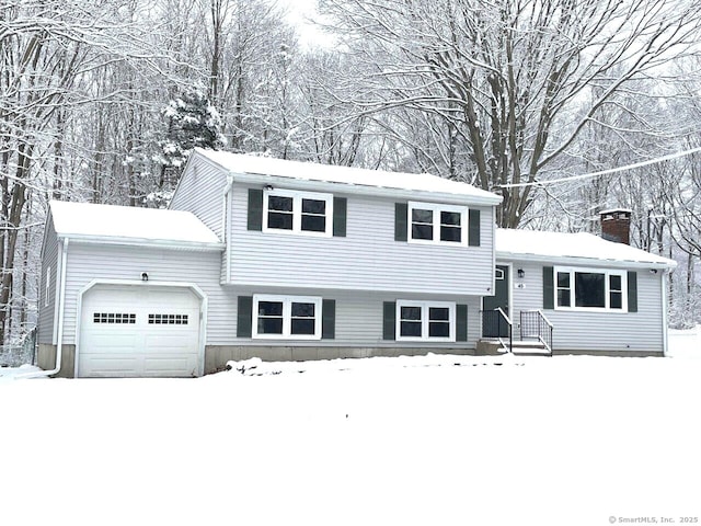 split level home featuring a garage