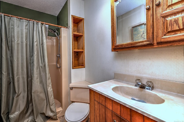 bathroom with a shower with curtain, vanity, toilet, and a textured ceiling