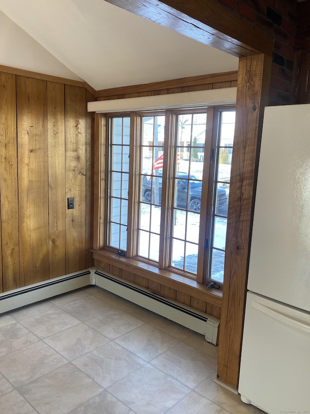 doorway to outside with a baseboard radiator and lofted ceiling