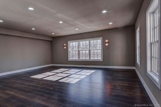 spare room featuring dark wood-type flooring