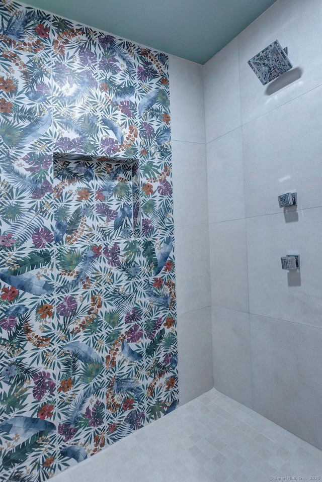 bathroom with a tile shower