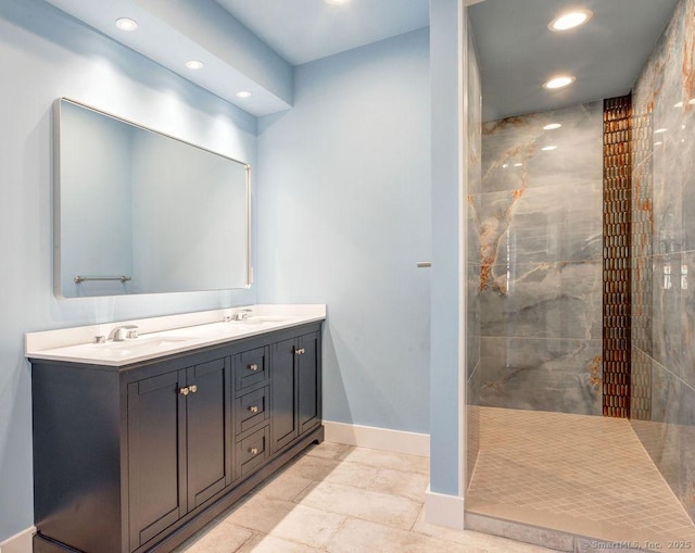 bathroom featuring vanity and a tile shower