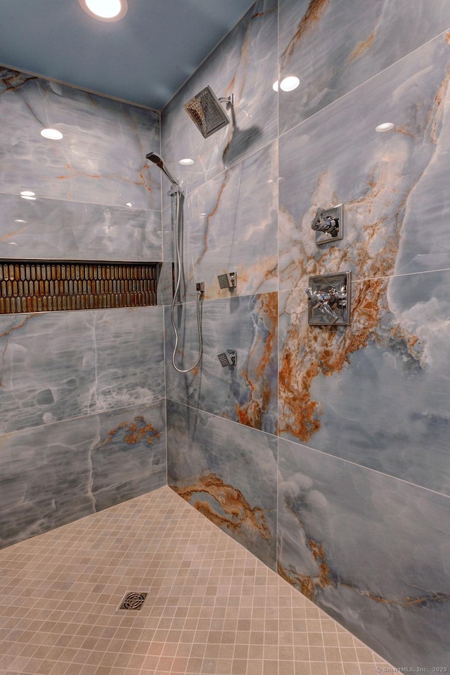 bathroom with a tile shower