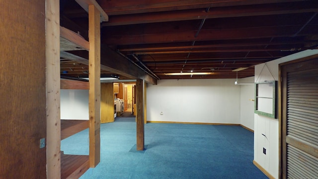 basement featuring washer / clothes dryer and carpet floors