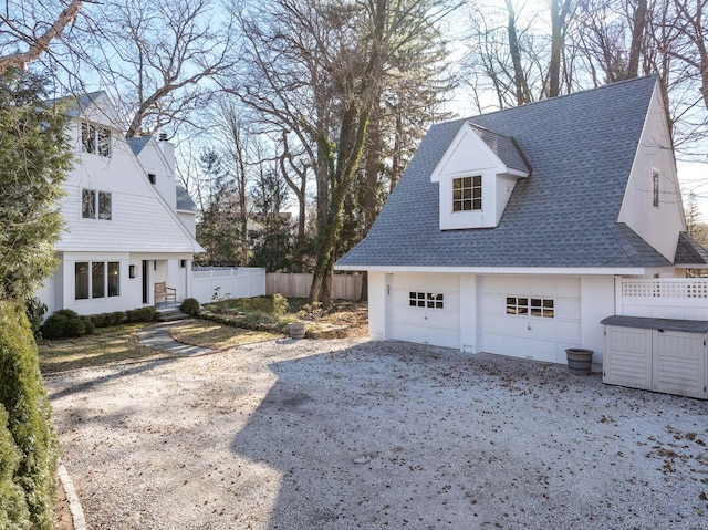 view of side of home with a garage