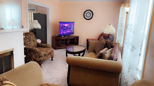 carpeted living room featuring a fireplace