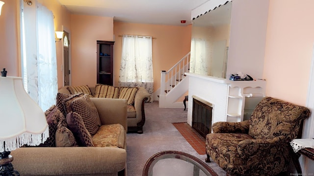 carpeted living room with a multi sided fireplace