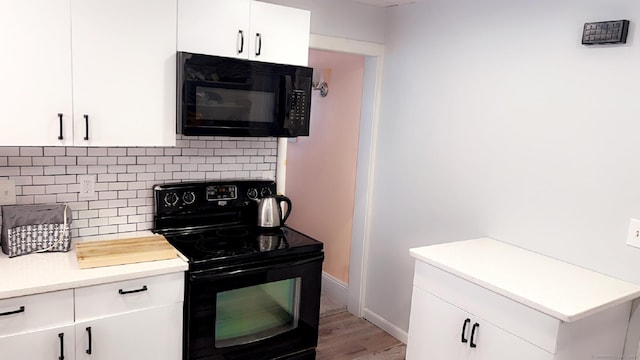 kitchen with white cabinetry and black appliances