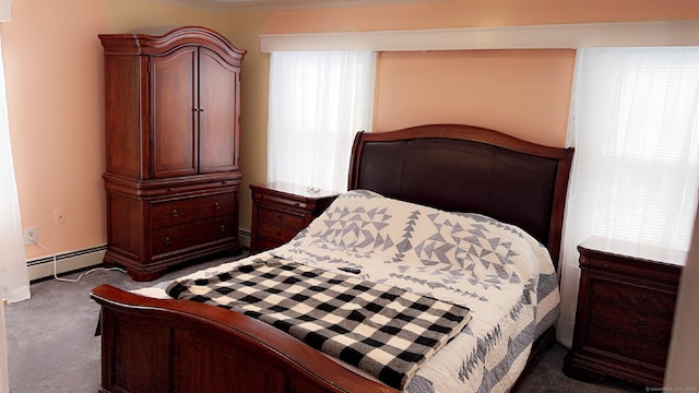 carpeted bedroom with a baseboard heating unit