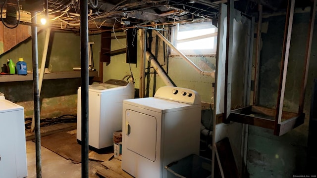 laundry area with independent washer and dryer