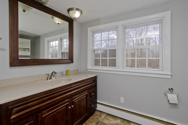 bathroom with a baseboard radiator and vanity