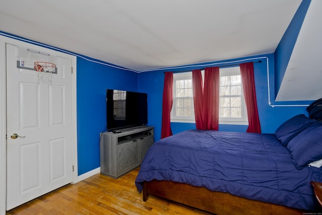 bedroom featuring light wood-type flooring